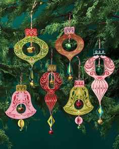 christmas ornaments hanging from a tree on a green background