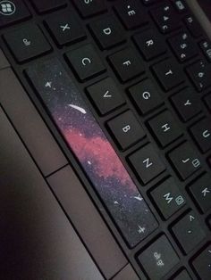 a close up of a laptop keyboard with space on the back cover and bottom case