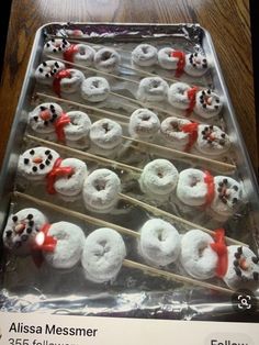 there are many donuts that have been made to look like snowmen on sticks