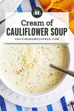 a bowl of cream of cauliflower soup on a blue and white table cloth