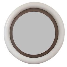 a round mirror with brown trim around the edges on a white wall mounted cabinet door