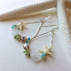 "Make sure to read all of the information below before you make a purchase: Made to order. Please see my policies page or my shop announcement for current production times on made to order items. These teardrops hoops have been embellished with sea shells and beach glass found from Hawaiian shores. Touches of color from apatite and peridot make these beachy beauties the perfect summertime accessory! These earrings include real starfish that are coated in several layers of resin. Although stronge Seashell Projects, Ocean Earrings, Earrings Beach, Green Beach, Shell Crafts Diy, Seashell Jewelry, Ocean Jewelry, Chic Earrings, Clever Crafts