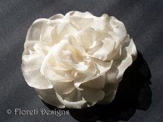 Ivory Magnolia LaLuna Silk Flower Bridal Hair Accessory, Wedding Hair Flower, Authentic Designer Headwear, Kentucky Derby Hat Flower LaLuna Abstract-Impressionist Magnolia delicate bridal hair flower accessory. Looks beautiful worn alone in hair, with a veil, or headband. Handmade in ivory satin organza.  Last image shows 'in hair' example of a 4 inch silk LaLuna Magnolia. Set on colibri hair clip. Other available attachments, http://floreti.biz/attachments.html Dimensions: About 3-1/2 inches in Elegant Flower-shaped Hair Accessories With Handmade Flowers, Elegant Flower Hair Accessories With Handmade Flowers, Cream Flower Headpieces For Weddings, Elegant Handmade Flower Hair Accessories, Cream Wedding Hair Accessories With Handmade Flowers, Wedding Hair Accessories With Handmade Cream Flowers, White Handmade Flower Hair Accessories For Wedding, Flower-shaped Wedding Fascinator, Elegant Flower Hair Accessories For Wedding