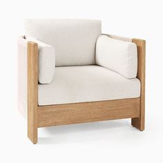 a wooden chair with a white cushion on the back and armrests, sitting in front of a white background