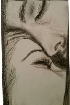 a pencil drawing of a woman's face with her eyes closed and long eyelashes