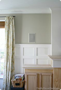 a living room with white walls and wood furniture in it's centerpieces