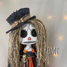 a doll with dreadlocks and a top hat