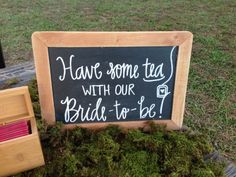 a sign that says have some tea with our bride - to - be on it