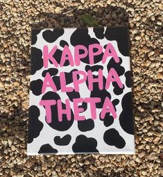 a sign that says kappa alpha thea on it