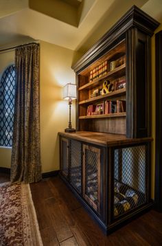 a book case in the corner of a room