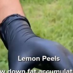 a person wearing black leggings with the words lemon peels on it's side