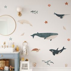 Nursery bathroom with sea animal stickers; a whimsical touch to the white walls Nursery Artwork Neutral, Ocean Animal Nursery Theme, Peel And Stick Wallpaper Kids Room, Nursery Ideas Sea Theme, Aquatic Nursery Theme, Ocean Toddler Room, Under The Sea Bedroom Ideas, Neutral Ocean Nursery, Under The Sea Baby Room