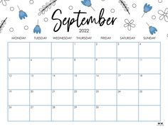 a calendar with blue flowers on it and the word september in black ink, is shown