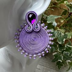 Description: Round Lila Statement Soutache Earrings, These Items Are Individually Made With Love By Me. Details: Handmade Item These Trendy Soutache Earrings Are 100% Handmade And Have One-Of-A-Kind Designs. Color: Purple Material: Viscose Cords & Beads Metal: Stainless Steal Dimensions: 2.1" Style: Elegant/ Boho Chic / Stylish/ Art Deco Care Instructions: Store Out Of Direct Sunlight And Keep Away From Water. It Is Not Recommended To Wear These Earrings In Or Around Water. Elegant Handmade Purple Clip-on Earrings, Elegant Purple Clip-on Earrings For Party, Purple Clip-on Earrings For Party, Adjustable Clip-on Party Earrings, Glam Earrings, Stylish Earrings, Stylish Art, Soutache Earrings, Stainless Steal