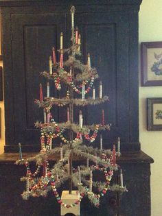 a small christmas tree sitting on top of a table