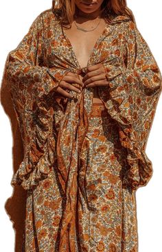 Bohemian V-neck Rayon Peasant Top, Bohemian Long Sleeve Blouse With Back Tassel Tie-up, Bohemian Rayon Blouse With Boho Print, Bohemian Summer Tops For Gatherings, Boho Bohemian-style Rayon Blouse, Bohemian Peasant Top With Back Tassel Tie-up, Bohemian Blouse For Fall Festival, Flowy Bohemian Rayon Blouse, Bohemian Tops With Floral Print And Kimono Sleeves