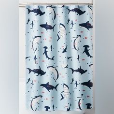 a shower curtain with sharks on it