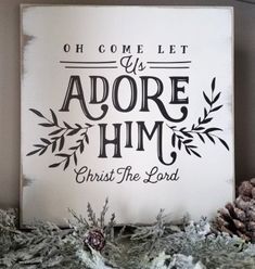 a sign that says, oh come let us adore him christ the lord