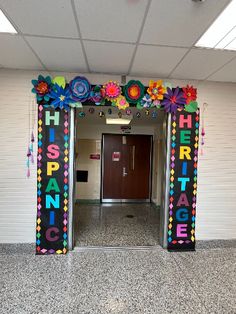 the entrance to an office building decorated with flowers