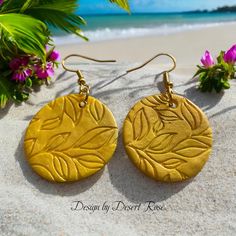 I love these OOAK Clay dangle earrings, designed with yellow clay and embossed too.  We used gold tone jump rings and ear wires too to finish these lovely earrings. There may be some variation or some imperfections with our clay designs but that's all part of their charm! No two clay designs are exactly alike. I do my best to make closely matched pairs. Treat these pieces gently as handmade jewelry can be delicate. A word about our Clay Post Earrings and pins, we bake the post with a bake adhesive and  bake liquid clay or polymer clay to over the post. So it takes some time to make these items. They should never fall apart. Gold Etched Earrings For Gift, Gold Etched Earrings As Gift, Gift Gold Etched Earrings, Gold Polymer Clay Jewelry For Crafting, Nickel Free Gold Polymer Clay Jewelry, Nickel-free Gold Polymer Clay Jewelry, Gold Dangle Earrings In Polymer Clay, Gold Polymer Clay Dangle Earrings, Gold Round Polymer Clay Earrings