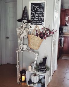 a skeleton sitting on top of a shelf next to a basket