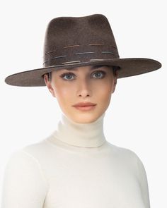 This unisex rocker hat is fashionable and chic. Wool felt is hand dyed and banded with three rows of hand-stitched cording. The raw edge medium-sized brim is structured to not lose its shape and will help keep the sun, (or spotlight) out of your eyes. The Crown is fully lined. The elasticized inner band fits most. Imported. Each hat is hand dyed for a softly distressed look, so there may be color variance which adds to its beauty. Brim Span: 3.75" Art Costume, Band Fits, Felt Fedora, Women's Headwear, Costume Institute, Raw Edge, Vanity Fair, Leather Accessories, Hand Stitched