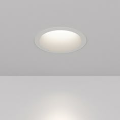 two different views of a ceiling light in the same room, one is white and the other is black