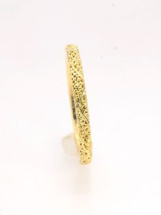 This is a one-of-a-kind Fine Silver or 18k ring handmade for you using the ancient process of granulation. The twining band is 2mm wide and has a continuous pattern around made with an ancient and unique process of granulation in 18k gold alloyed in my studio. Granulation is a controlled fusing process that has been utilized for thousands of years. This unique surface will get more interesting with wear. The components, sheet, wire and granules as well as the round ingot for the setting are all Byzantine Yellow Gold Engraved Rings, Byzantine Engraved Yellow Gold Rings, Byzantine Style Engraved Yellow Gold Ring, Ceremonial Yellow Gold Hammered Jewelry, Ceremonial Hammered Yellow Gold Jewelry, Engraved 22k Yellow Gold Rings, Yellow Gold Etched Bands As Gift, Yellow Gold Etched Bands For Gifts, Etched Yellow Gold Bands As Gift