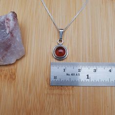 "Visit our on-line shop at: Etsy.com/shop/AlbuquerqueDesigns *sterling silver necklace pendant *Small pendant with silver box chain necklace 18\" *southwestern jewelry *carnelian / healing carnelian *calibrated pre-cut stones: 8mm round shape *back of jewelry items are all covered / do not show the back of stones *all jewelry items are made to ship, slight variations in stones will occur comparing to pictures. *size of a penny is 19mm or a dime is 18mm in diameter for comparing size with jewelry Red Carnelian, Carnelian Necklace, Box Chain Necklace, Southwestern Jewelry, Silver Box, Sterling Silver Necklace Pendants, Small Pendant, Turquoise Pendant, Box Chain