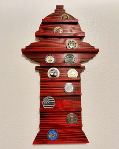 a clock made out of wooden planks with different buttons on the front and sides