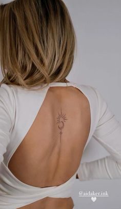 a woman with a tattoo on her back