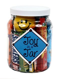 a jar filled with assorted candy and an emoticive sticker that says, joy is a star