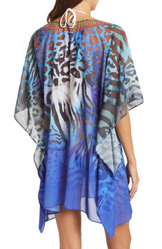 Unleash your free boho spirit in this poncho styled with vivid allover prints. 34'' length (O/S) V-neck Kimono sleeves All-over print Woven 100% polyester Dry clean Imported Model stats: 5'10", 32" bust, 25" waist, 36" hip. Model is wearing size OS. Multicolor Poncho For Beach Cover-up In Summer, Blue Printed V-neck Cover-up, Casual Multicolor Poncho For Vacation, Multicolor Printed Cover-up With Kimono Sleeves, Multicolor Summer Poncho For Vacation, Spring Multicolor Poncho For Beach, Multicolor Summer Vacation Poncho, Spring Beach Multicolor Poncho, Spring Multicolor Beach Poncho