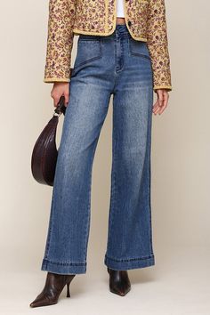 A sleek design and angular pockets lend contemporary appeal to our medium wash blue jeans, which features a high rise, wide leg, double button waistband, front and back pockets, back D-ring detail, and tonal blue stitching for a fresh spin on a classic. Style #: 83848 Equestrian Chic, Fall Prints, Leather Dresses, Denim Design, New Shop, Biker Jacket, Jeans For Sale, Denim Shop, Skirt Pants