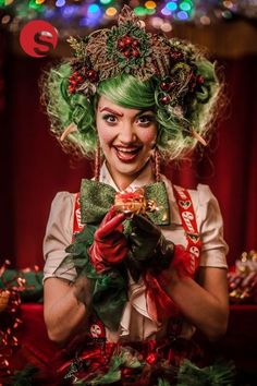 a woman with green hair and clown makeup