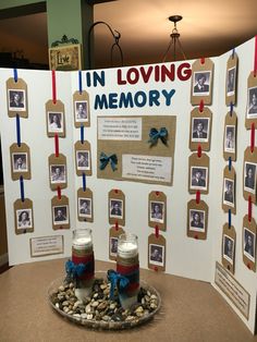 a memorial display with two jars and ribbons