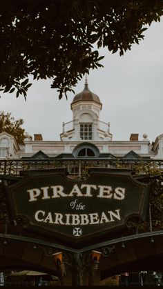 the sign for pirates of the carribean is in front of an ornate building