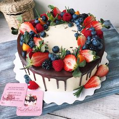 there is a cake with fruit on it