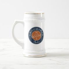 a beer mug with the name groomsmans on it and an orange circle in the middle