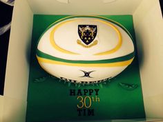 a rugby ball in a box with the number 30 on it