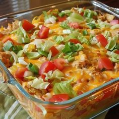 a casserole dish filled with lots of toppings on top of a table