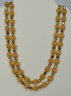 Alfred Philippe was Crown Trifari's Chief Designer from 1930 until 1968.  This exquisite necklace and earrings set was introduced during that time period and became referred to simply as the "Electra Collection".  The collection pieces utilized two innovative and striking types of beads.  The first type was the so called "Trifanium" spiked bead.  The second type was a gold plated crystal called an "Autrum" bead.  The intent of the Electra design was simply to "blow away" the competition--which i Gold Plated Round Beads Jewelry For Formal Events, Gold Plated Round Beads Jewelry For Formal Occasions, Formal Gold Plated Jewelry With Round Beads, Gold Plated Jewelry With Round Beads For Formal Occasions, Formal Gold Plated Jewelry, Formal Round Jewelry With Gold Beads, Yellow Gold Double Strand Jewelry For Wedding, Vintage 22k Gold Hallmarked Jewelry, Vintage Yellow Gold Polished Bead Necklace