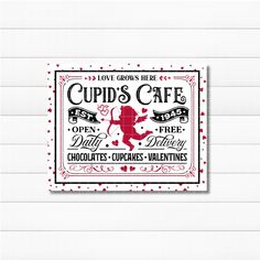 a cupid's cafe sign on a white wall