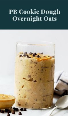 a glass jar filled with cookie dough overnight oats on top of a white table