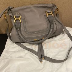 Excellent Medium Marcie Calfskin Leather Satchel. 10"W X 10 1/2"H X 4 1/2"D. (Interior Capacity: Medium.) 5 ½" Strap Drop; 17 ½" Shoulder Strap Drop. 2.1 Lb. Top Zip Closure Top Carry Handles; Removable Shoulder Strap Exterior Pocket Interior Zip And Slip Or Snap-Tab Pockets Leather Made In Italy Bought At Stanford Nordstrom Note 2 Small Marks On Back Left Side Chloe Marcie Satchel Medium, Chloe Mini C Bag, Chloe Mini Bag, Chloe C Bag, Chloe Crossbody Bag, Chloe Marcie Bag, Chloe Nile, Chloe Brown, Chloe Bags