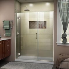 a bathroom with a walk in shower next to a sink