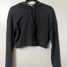 Like New Condition. Never Worn. Limited Edition (Style Not Available On Website Anymore). Cropped Fit. All Black. Gym Shark Scropped Zip Up, Gymshark Black Set, Gym Shark Long Sleeve Crop, Gymshark Sports Bra Black, Black Cropped Sporty Sweatshirt, Gymshark Black, Black Sweatshirt, Tops Black, Cropped Hoodie