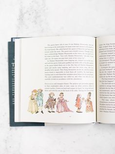 an open book with children's drawings on it