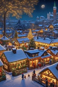 a christmas village with lots of lights and people walking around it in the snow at night