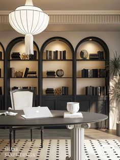 a room with bookshelves and a table in front of the bookcases